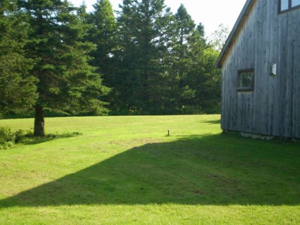 Side of cottage, looking West